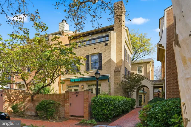 a view of a pathway both side of the house