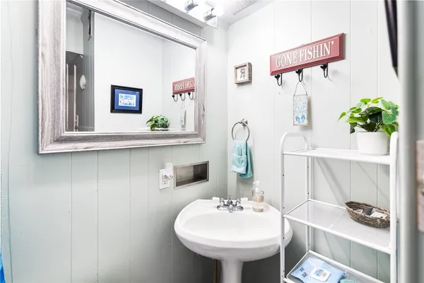 a bathroom with a sink and a mirror