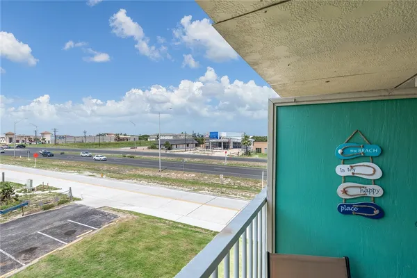 a view of swimming pool from a balcony