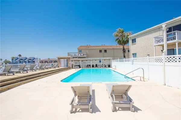 a view of a swimming pool with a terrace