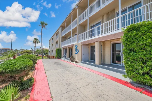 a view of a building with a yard