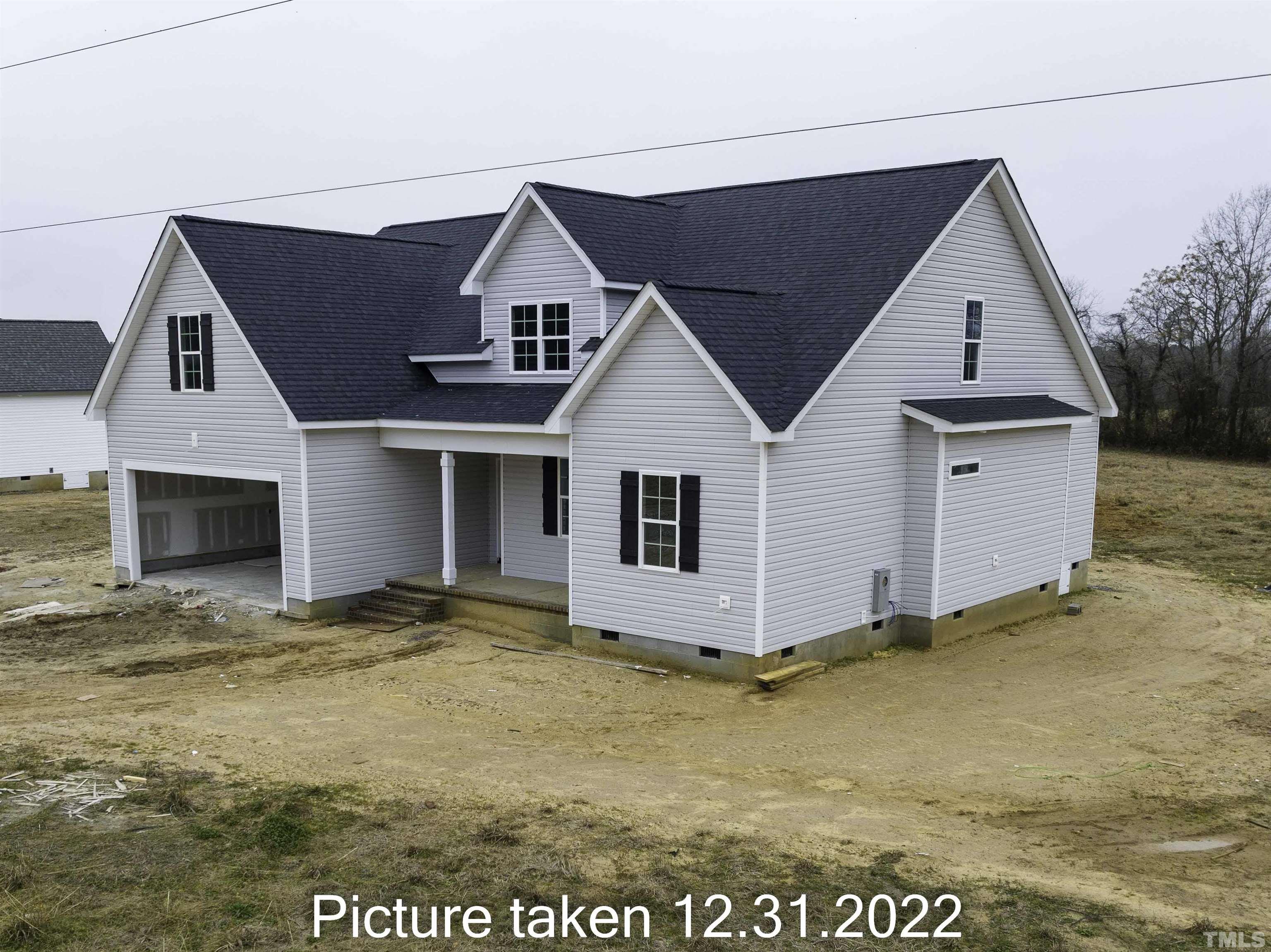 5140 Frazier Road Middlesex, NC 27557 - Photo 33 of 35 a view of house with yard and garage