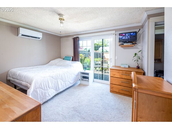 4848 Daisy Street Springfield, OR 97478 - Photo 23 of 36 a bedroom with a bed and a large window