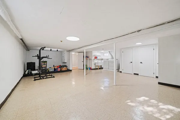 a view of a livingroom with furniture and a garage