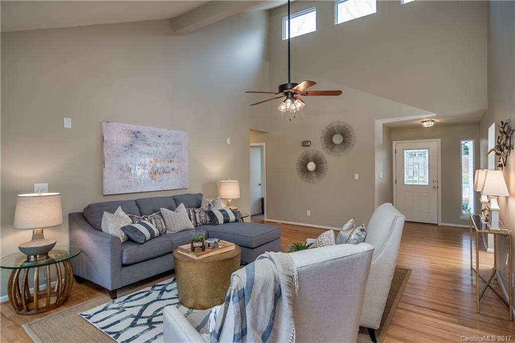 9300 Fairway Ridge Road Charlotte, NC 28277 - Photo 1 of 23 a living room with furniture and a chandelier
