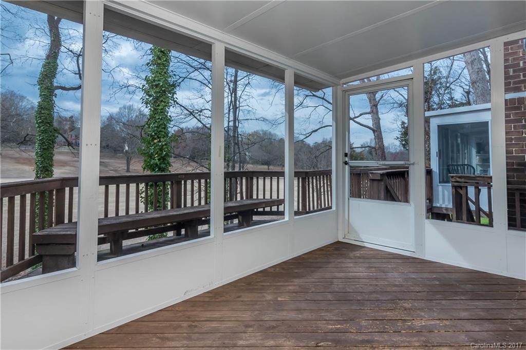 9300 Fairway Ridge Road Charlotte, NC 28277 - Photo 11 of 23 an empty room with wooden floor and windows