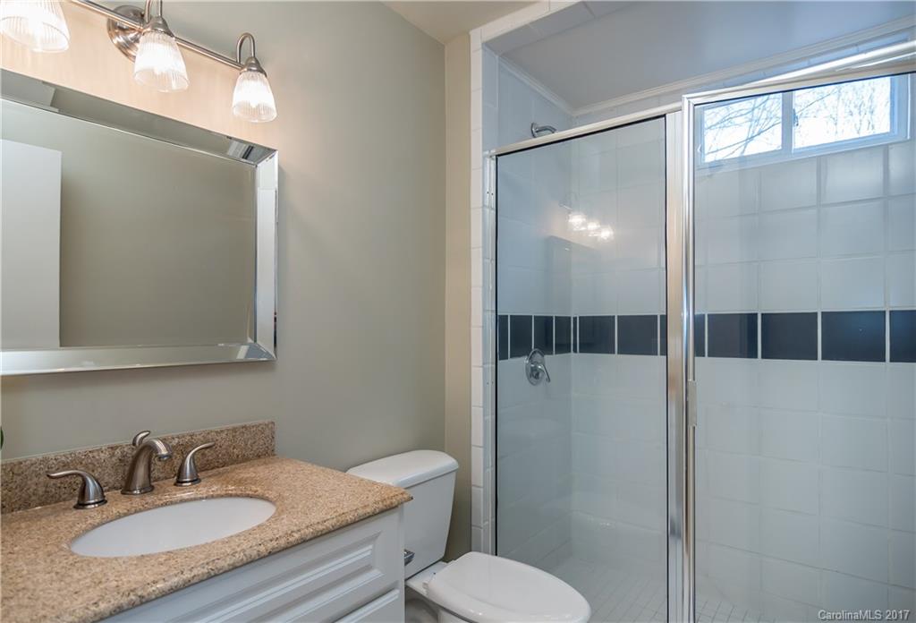 9300 Fairway Ridge Road Charlotte, NC 28277 - Photo 17 of 23 a bathroom with a sink toilet a mirror and shower