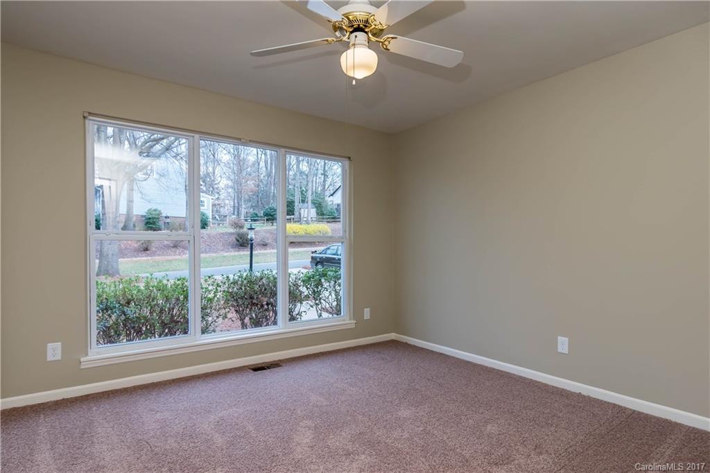 9300 Fairway Ridge Road Charlotte, NC 28277 - Photo 18 of 23 an empty room with windows and fan