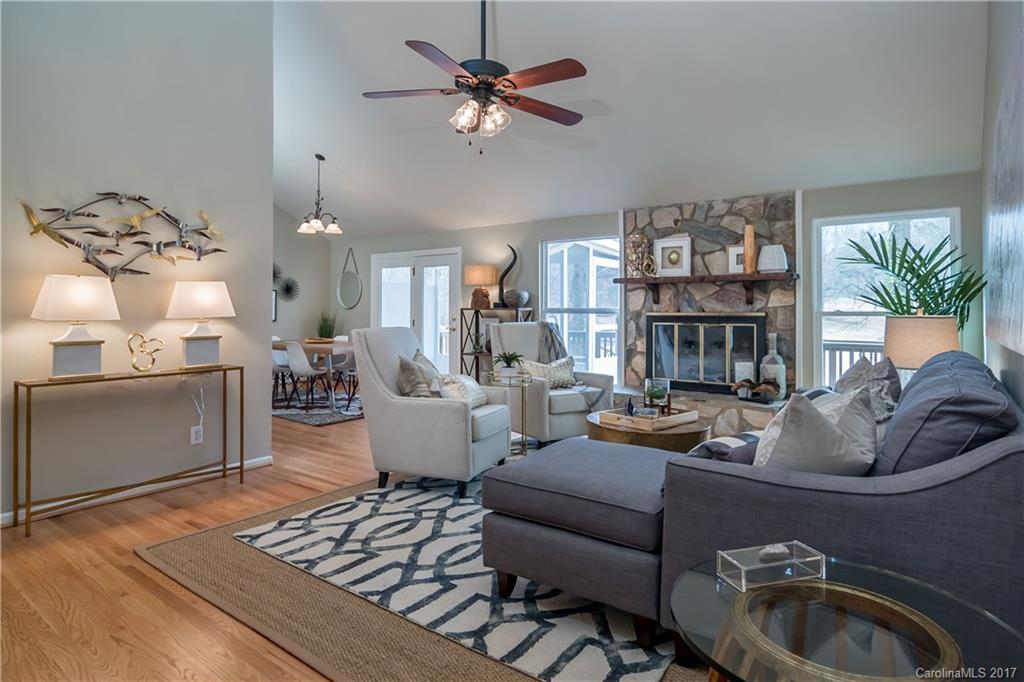 9300 Fairway Ridge Road Charlotte, NC 28277 - Photo 3 of 23 a living room with furniture fireplace and a chandelier