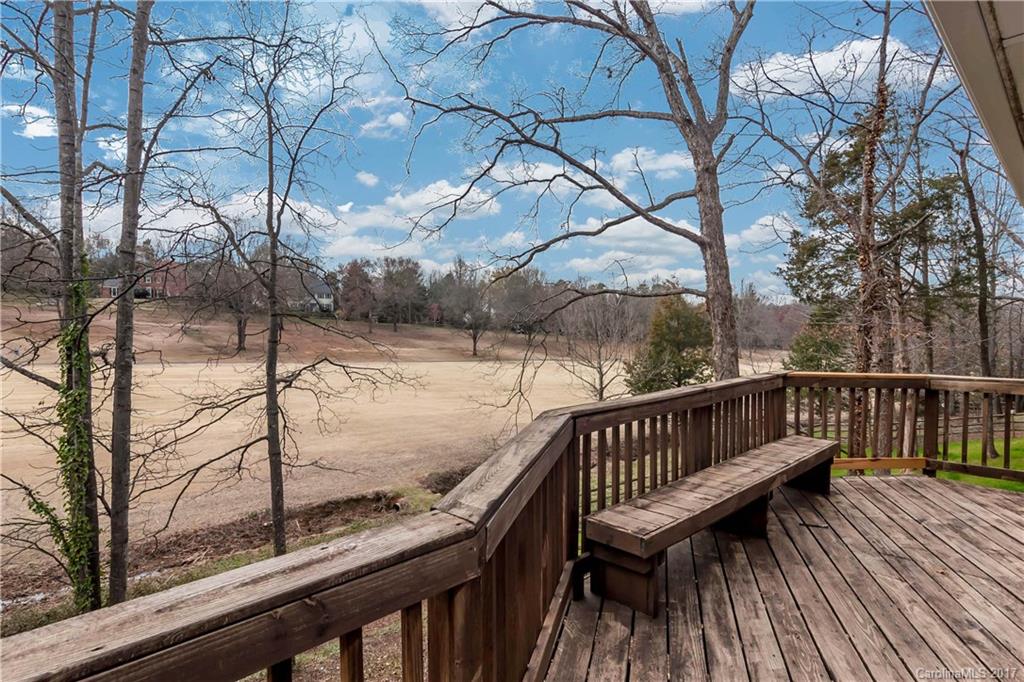 9300 Fairway Ridge Road Charlotte, NC 28277 - Photo 21 of 23 a view of a wooden deck with a bench