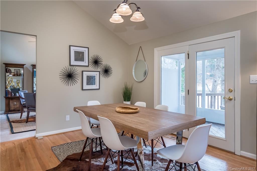 9300 Fairway Ridge Road Charlotte, NC 28277 - Photo 4 of 23 a view of a dining room with furniture and wooden floor