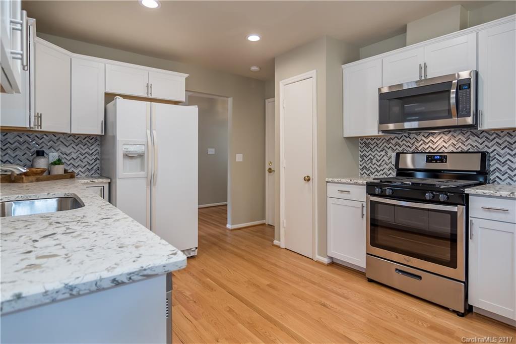9300 Fairway Ridge Road Charlotte, NC 28277 - Photo 7 of 23 a kitchen with a stove and a microwave