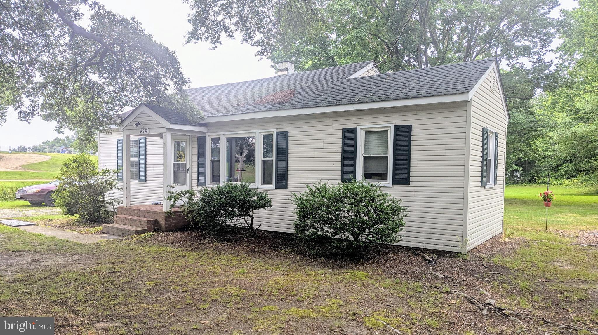 24992 Sotterley Road Hollywood, MD 20636 - Photo 3 of 3 a view of a house with a yard and a garden
