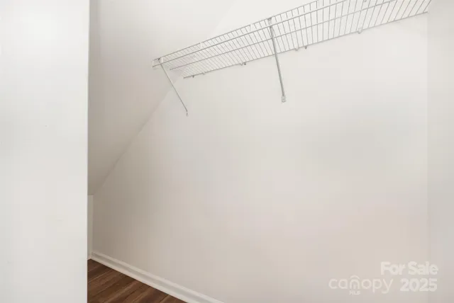 a bedroom with a large bed and a couch