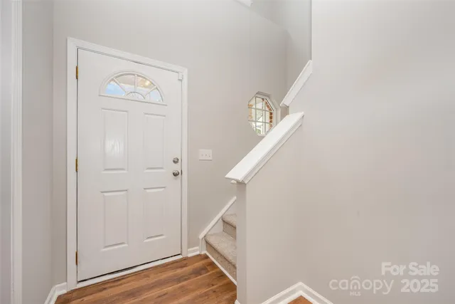 a view of an entryway with front door