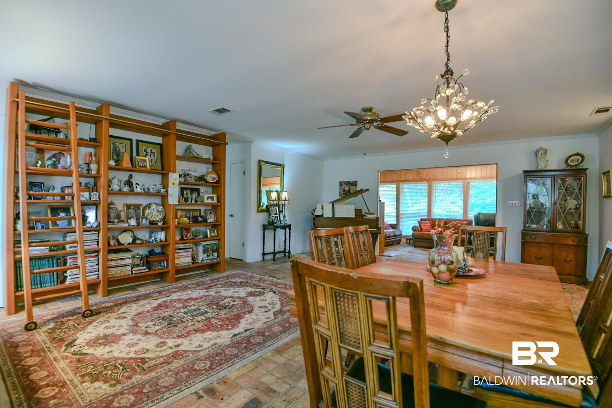 90 Paddock Drive Fairhope, AL 36532 - Photo 5 of 23 Dining room with brick flooring, a ceiling fan, and a chandelier