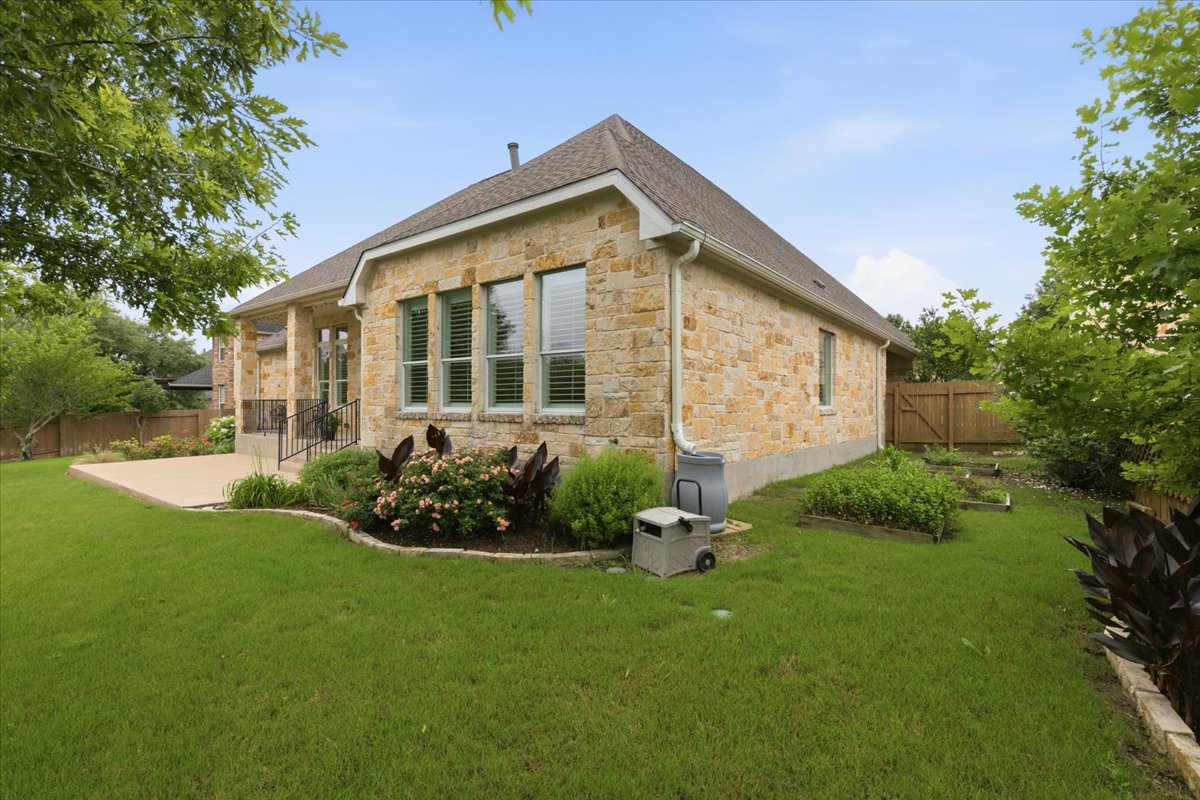 1709 Grassy Field Road Austin, TX 78737 - Photo 27 of 31 Lovely gardens and large trees you will not find in new build.