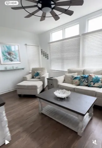 a view of a dining room with furniture and a window