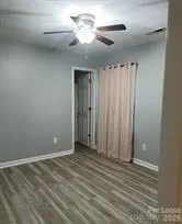 a view of room with a ceiling fan