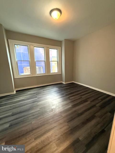 6245 Market Street Philadelphia, PA 19139 - Photo 3 of 8 wooden floor in an empty room with a window