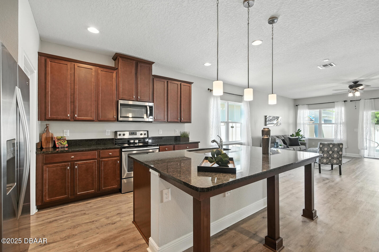 5428 Estero Loop Port Orange, FL 32128 - Photo 14 of 41 a kitchen with sink refrigerator and cabinets