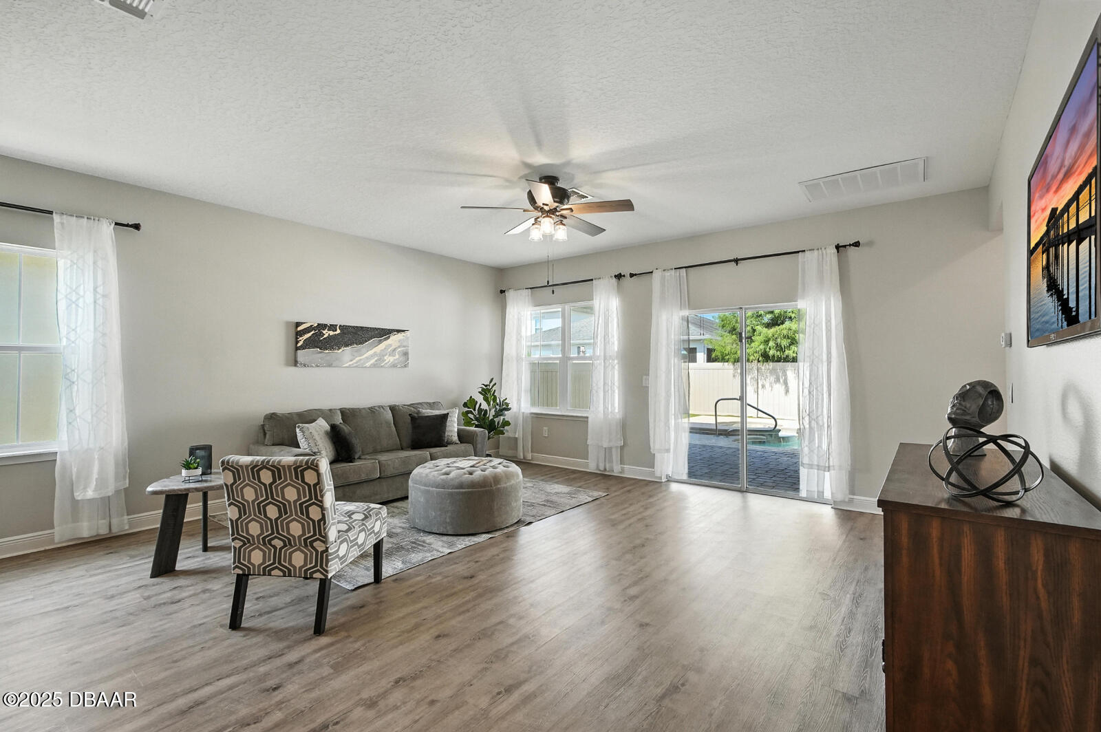 5428 Estero Loop Port Orange, FL 32128 - Photo 18 of 41 a living room with furniture a window and wooden floor