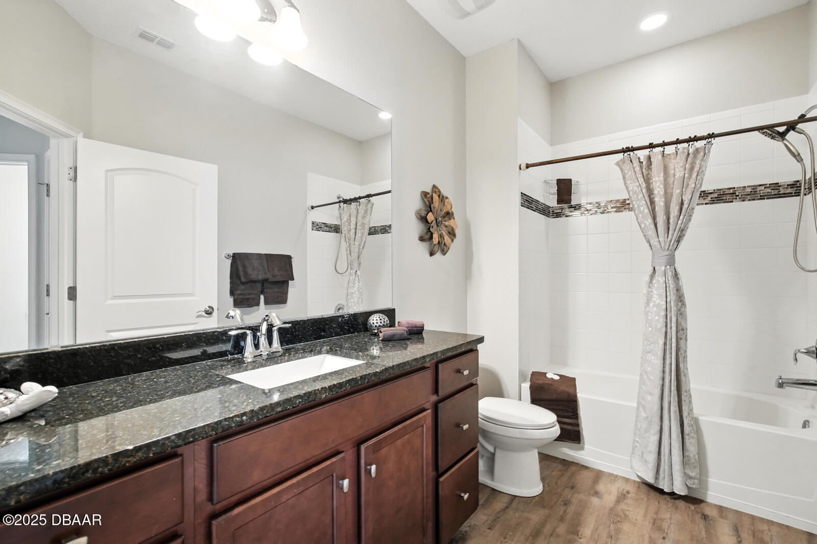 5428 Estero Loop Port Orange, FL 32128 - Photo 20 of 41 a bathroom with a granite countertop sink toilet and shower