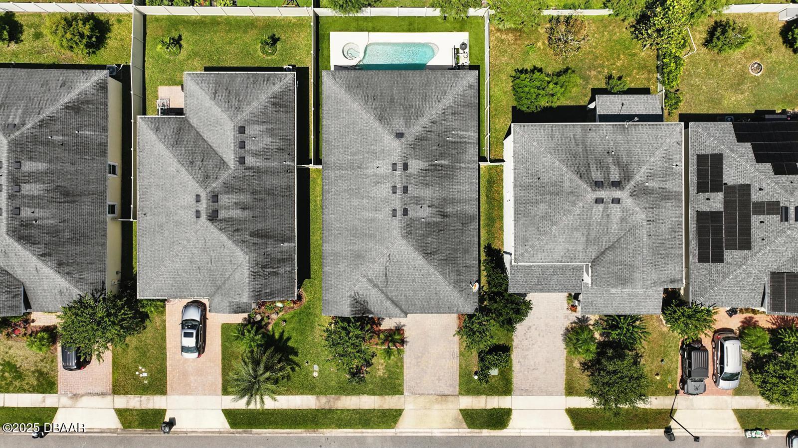 5428 Estero Loop Port Orange, FL 32128 - Photo 38 of 41 an aerial view of a residential apartment building with a yard and parking spaces