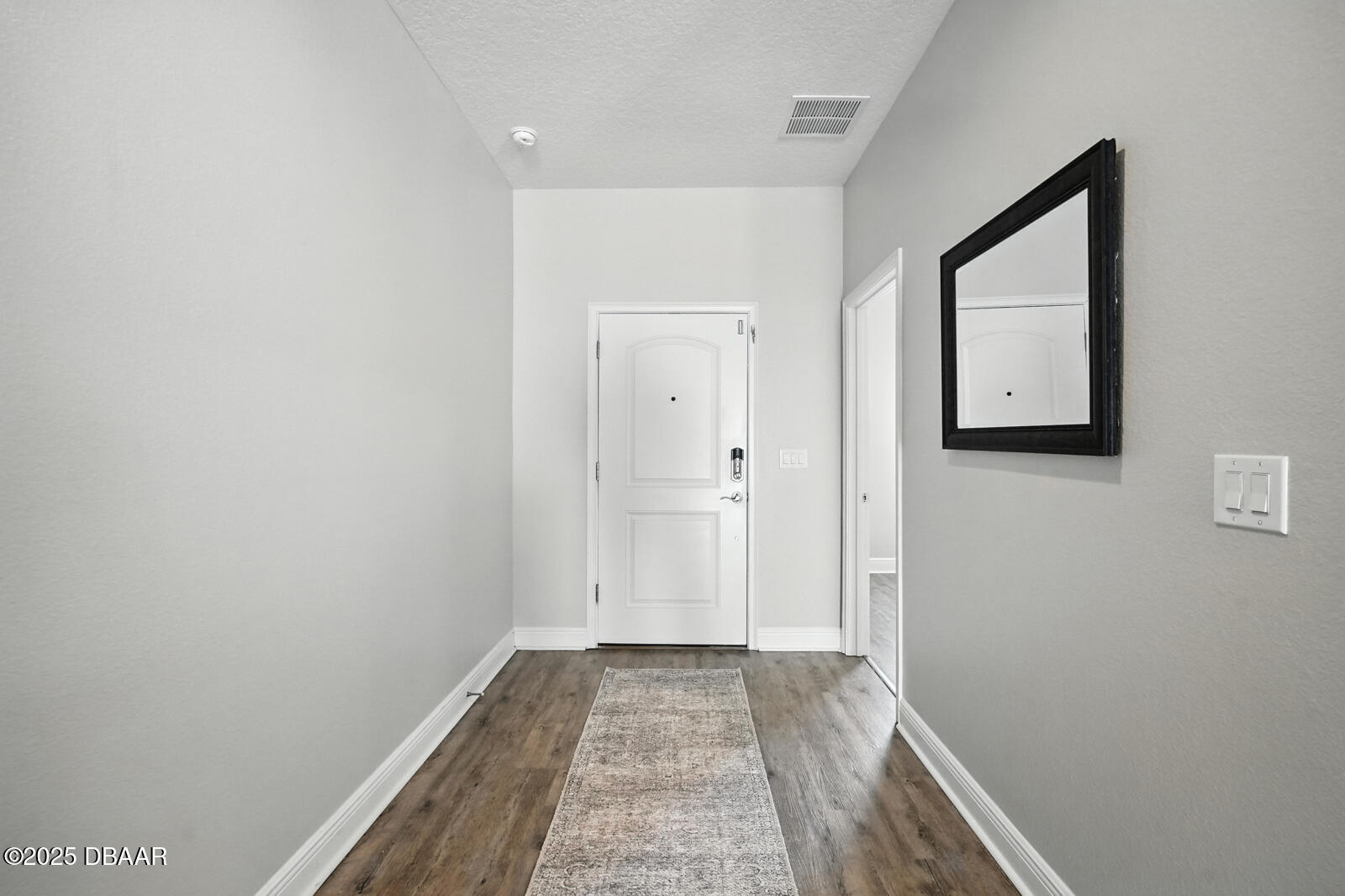 5428 Estero Loop Port Orange, FL 32128 - Photo 7 of 41 a view of a hallway with wooden floor