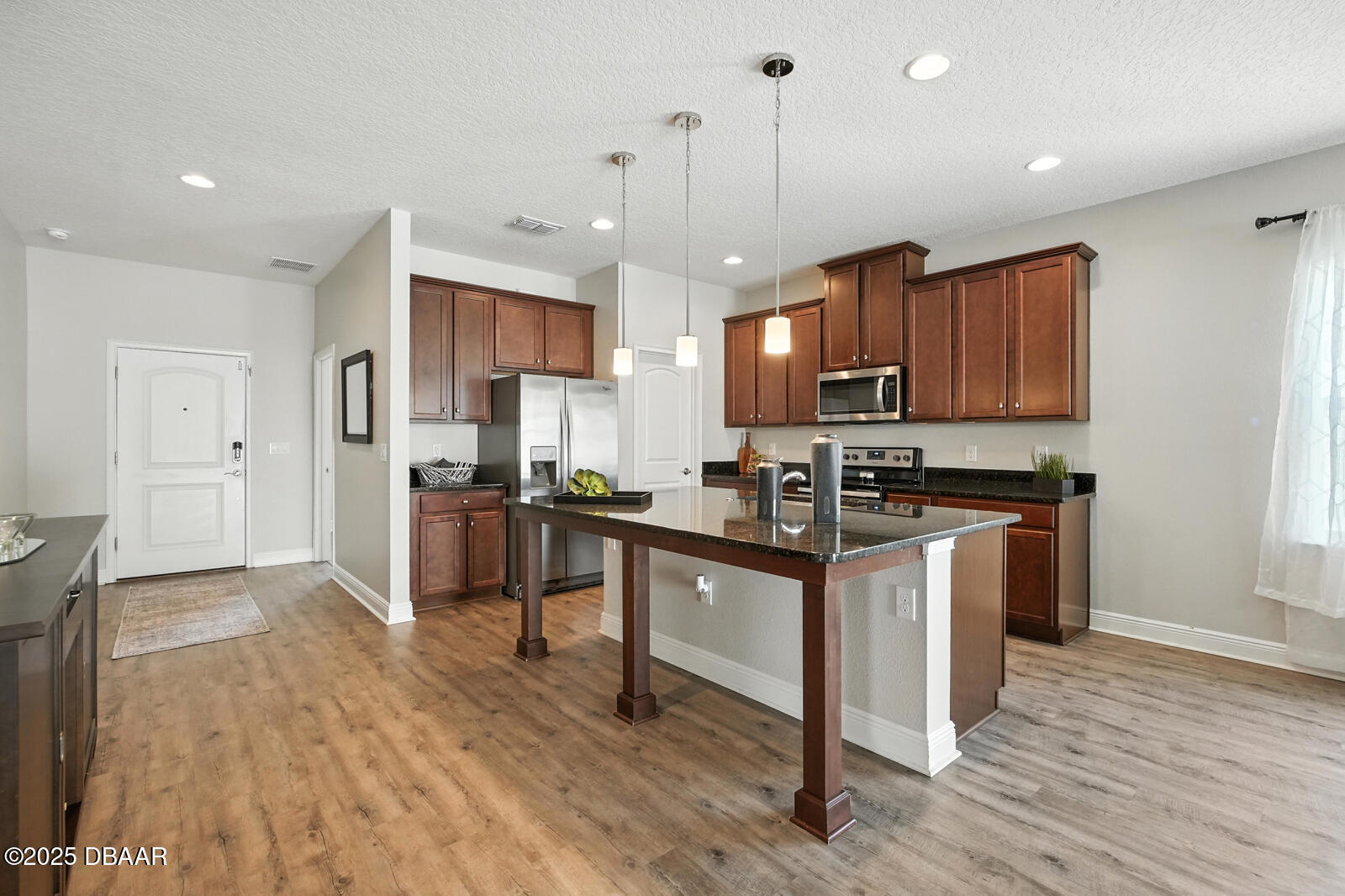 5428 Estero Loop Port Orange, FL 32128 - Photo 9 of 41 a kitchen with granite countertop a stove a sink dishwasher a refrigerator and a oven with wooden floor