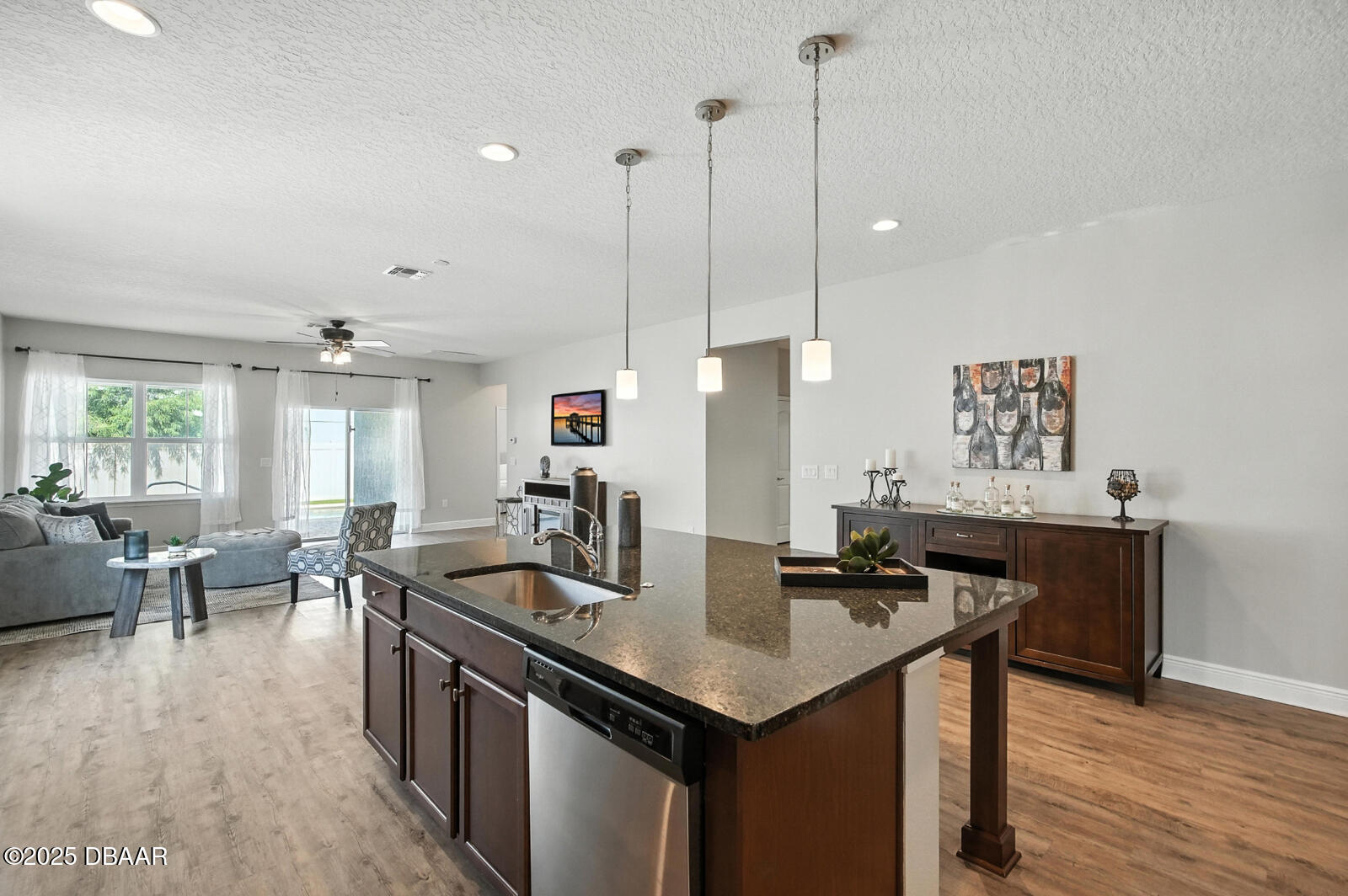 5428 Estero Loop Port Orange, FL 32128 - Photo 10 of 41 a kitchen with center island a sink appliances and wooden floor