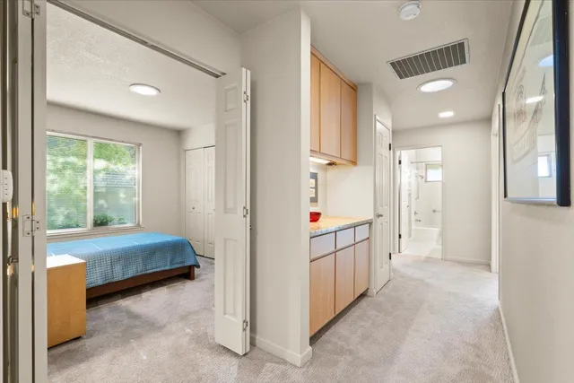 a bedroom with a bed and a dresser