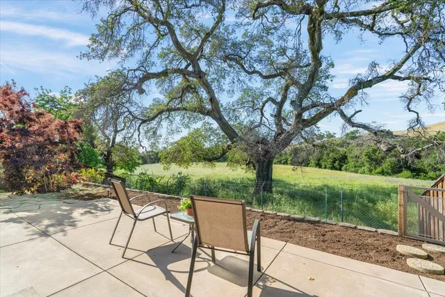 a view of swimming pool with outdoor seating and yard