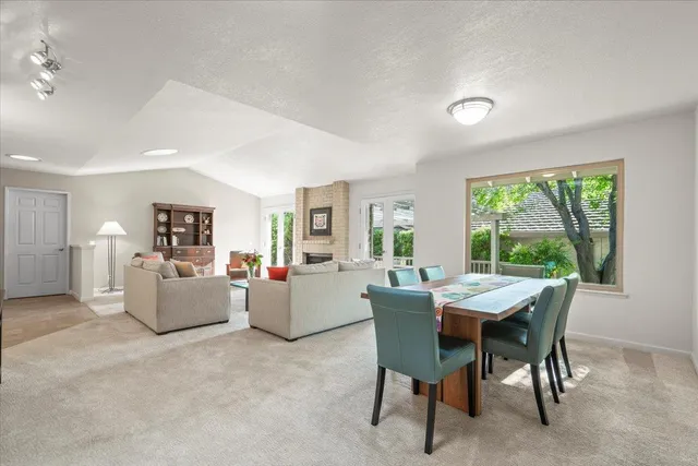 a view of a dining room with furniture window and outside view