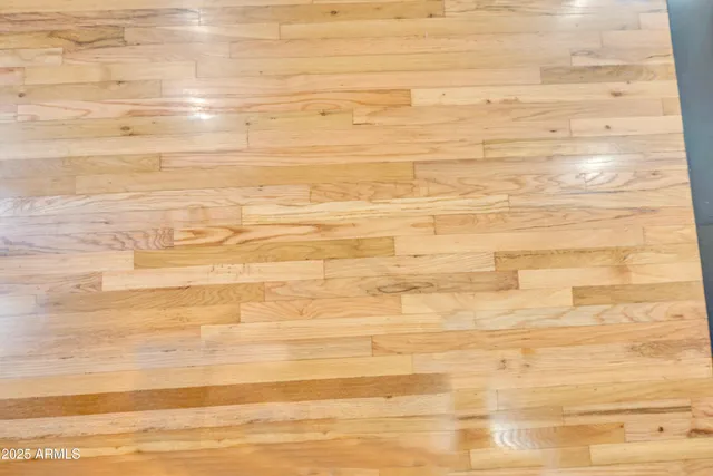 a bedroom with furniture and a wooden floor