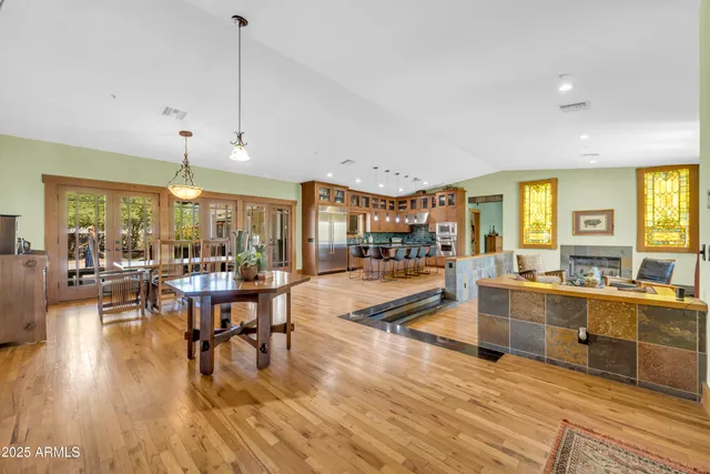 a bedroom with furniture and a flat screen tv
