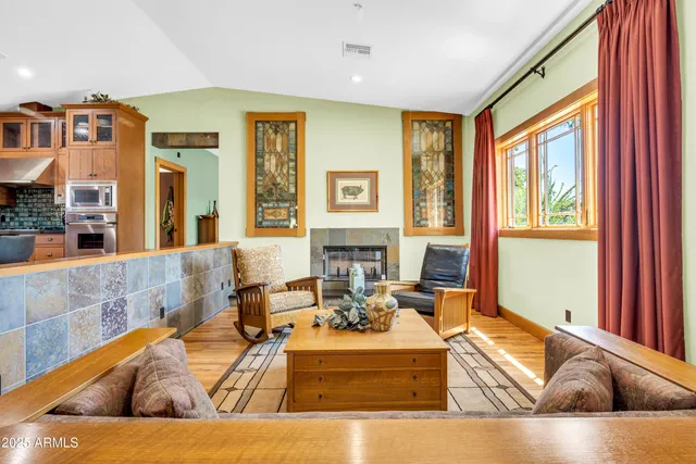 a kitchen with stainless steel appliances kitchen island granite countertop a refrigerator and a sink