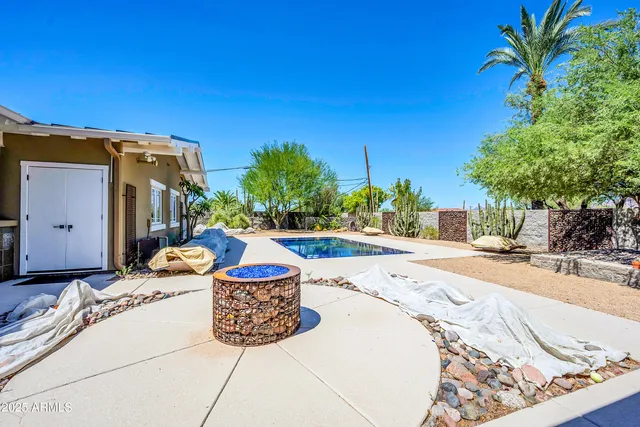 a view of a street with wooden fence
