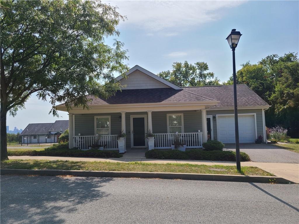 136 Pleasant Ridge Road McKees Rocks, PA 15136 - Photo 1 of 22 a view of a house with a swimming pool