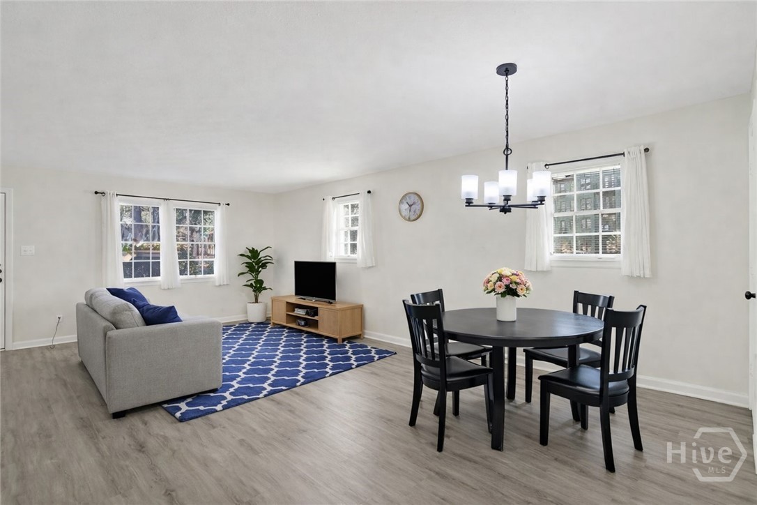 3 Berkley Place Savannah, GA 31405 - Photo 13 of 36 Open-concept living and dining area featuring abundant natural light and stylish, functional layout.