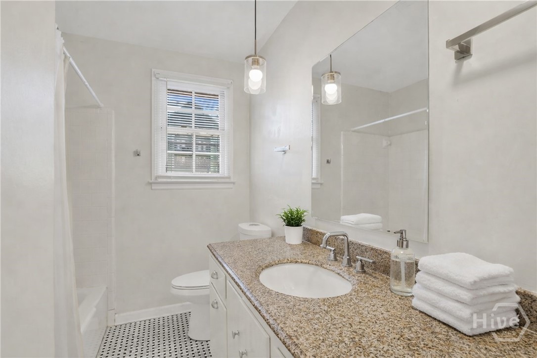 3 Berkley Place Savannah, GA 31405 - Photo 20 of 36 Bright bathroom featuring granite vanity, modern lighting, and clean, neutral finishes.