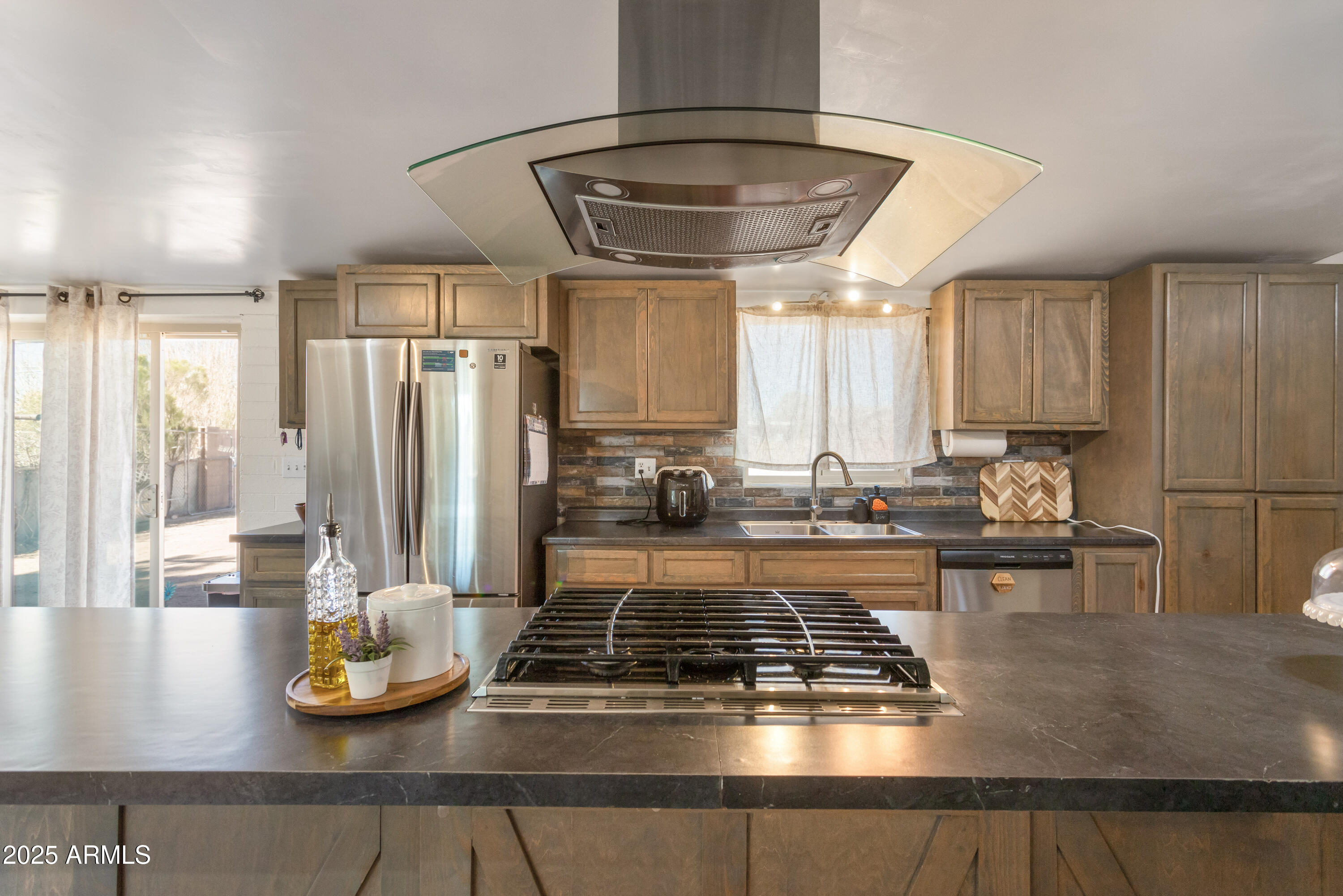 2128 East 8th Street Douglas, AZ 85607 - Photo 12 of 32 a kitchen with kitchen island granite countertop a sink and a counter top space
