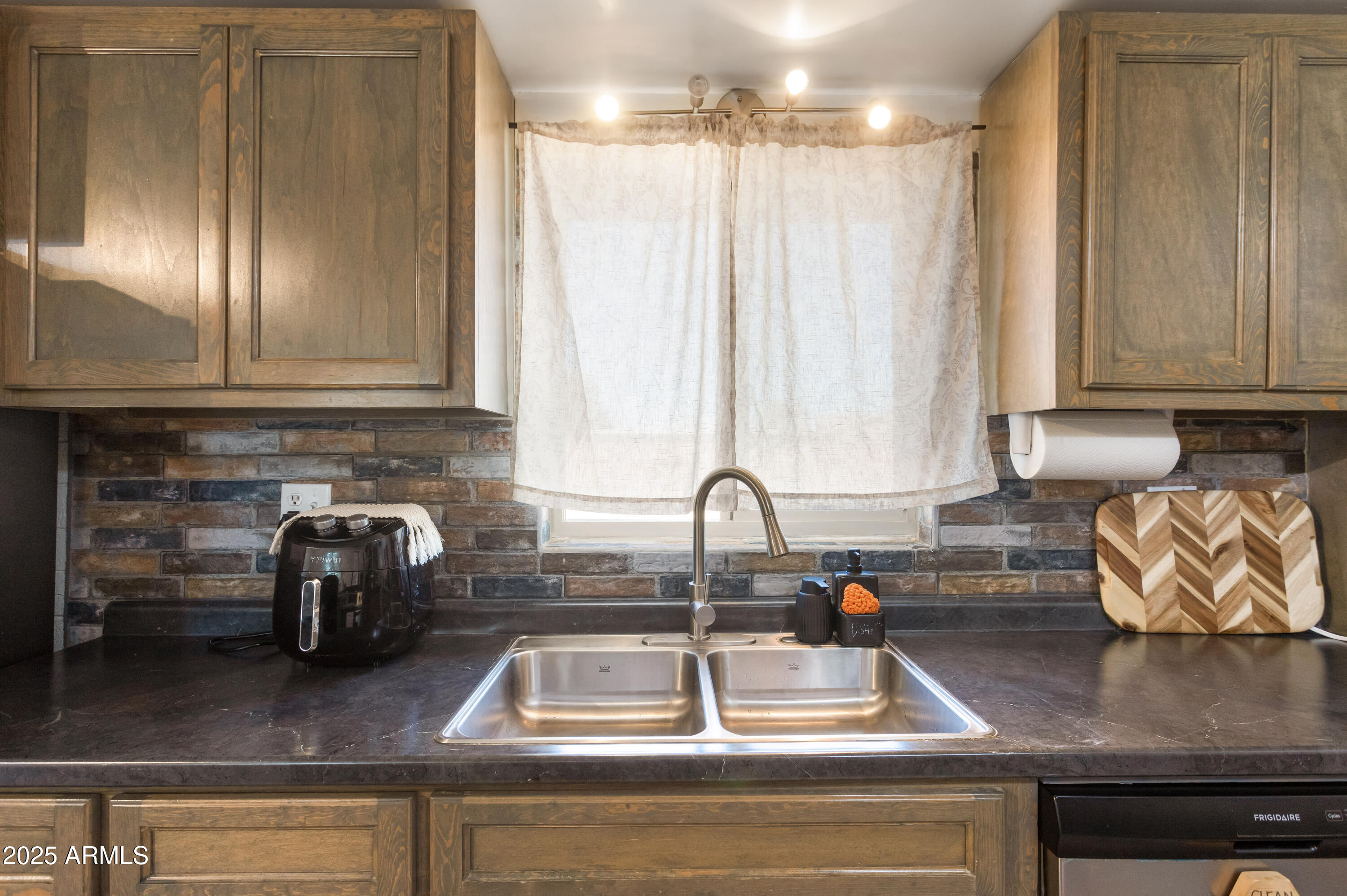 2128 East 8th Street Douglas, AZ 85607 - Photo 15 of 32 a kitchen with a refrigerator and a sink