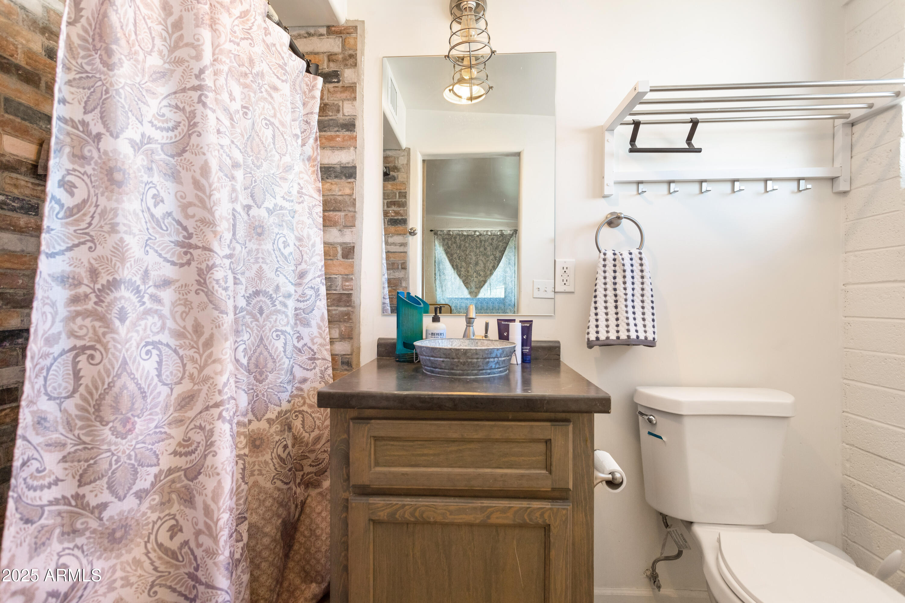 2128 East 8th Street Douglas, AZ 85607 - Photo 20 of 32 a bathroom with a sink toilet and mirror