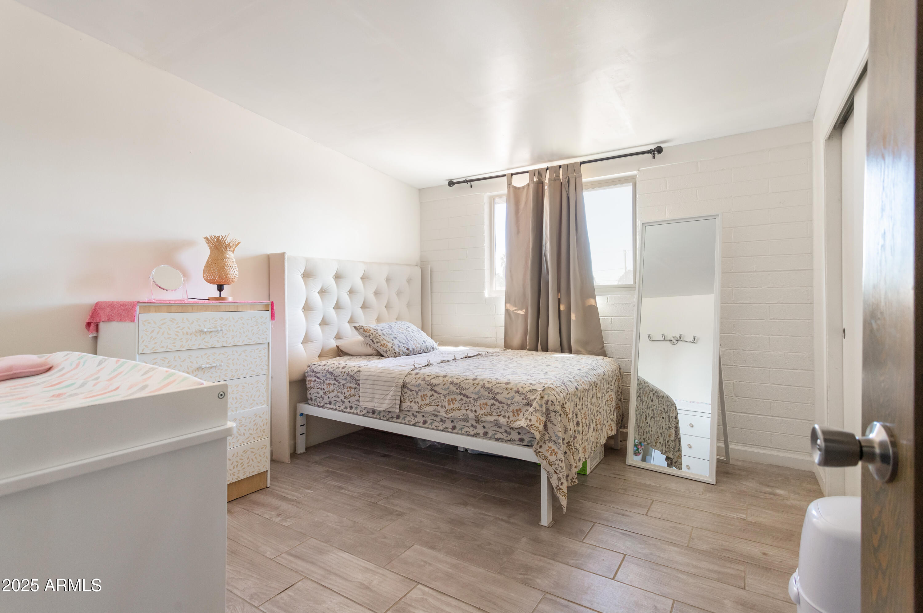 2128 East 8th Street Douglas, AZ 85607 - Photo 24 of 32 a bedroom with a bed and a table