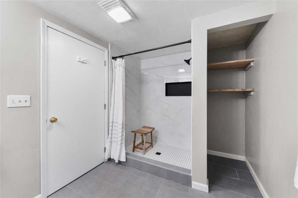 4930 Ashbaugh Road Murrysville, PA 15668 - Photo 19 of 44 Master Bathroom New Walk in Shower with wood storage shelves on side