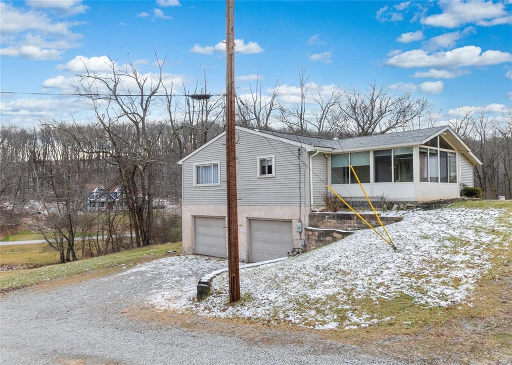 4930 Ashbaugh Road Murrysville, PA 15668 - Photo 33 of 44 Side and front view with 2 car garage