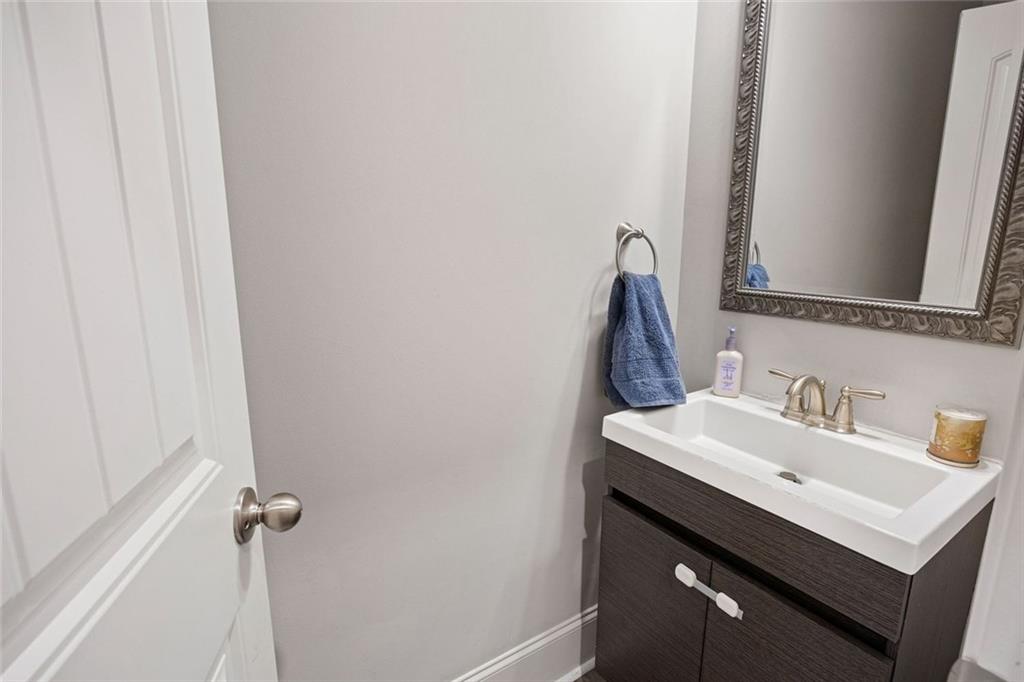 641 Little Bear Loop Canton, GA 30114 - Photo 15 of 37 a bathroom with a sink and a mirror