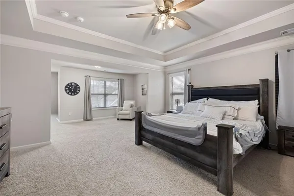 a bed room with a bed and a chandelier