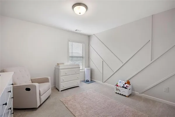 a view of a room with baby crib